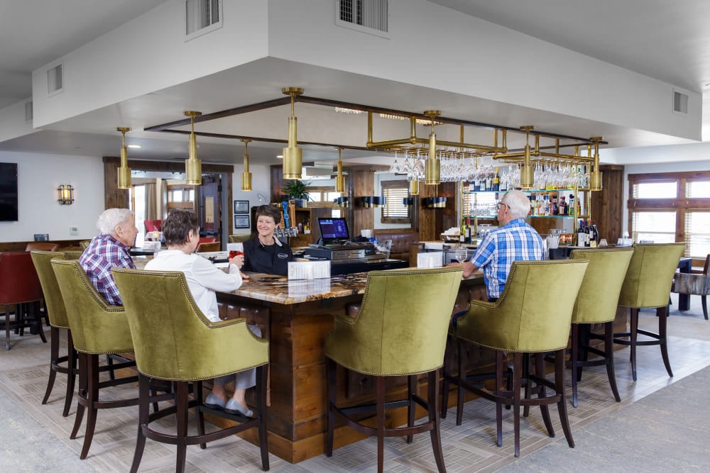 Bar area with spacious seating at Touchmark at Pilot Butte in Bend, Oregon