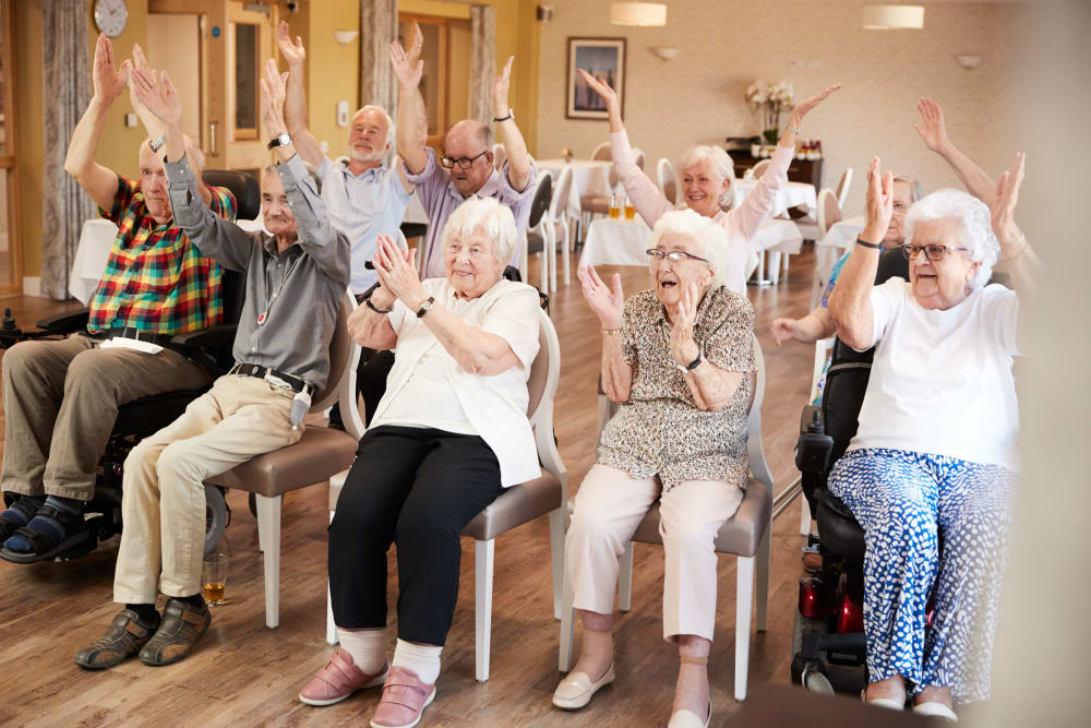 Residents taking a fitness class together at Cloudberry Lodge at Brandon in Brandon, Florida
