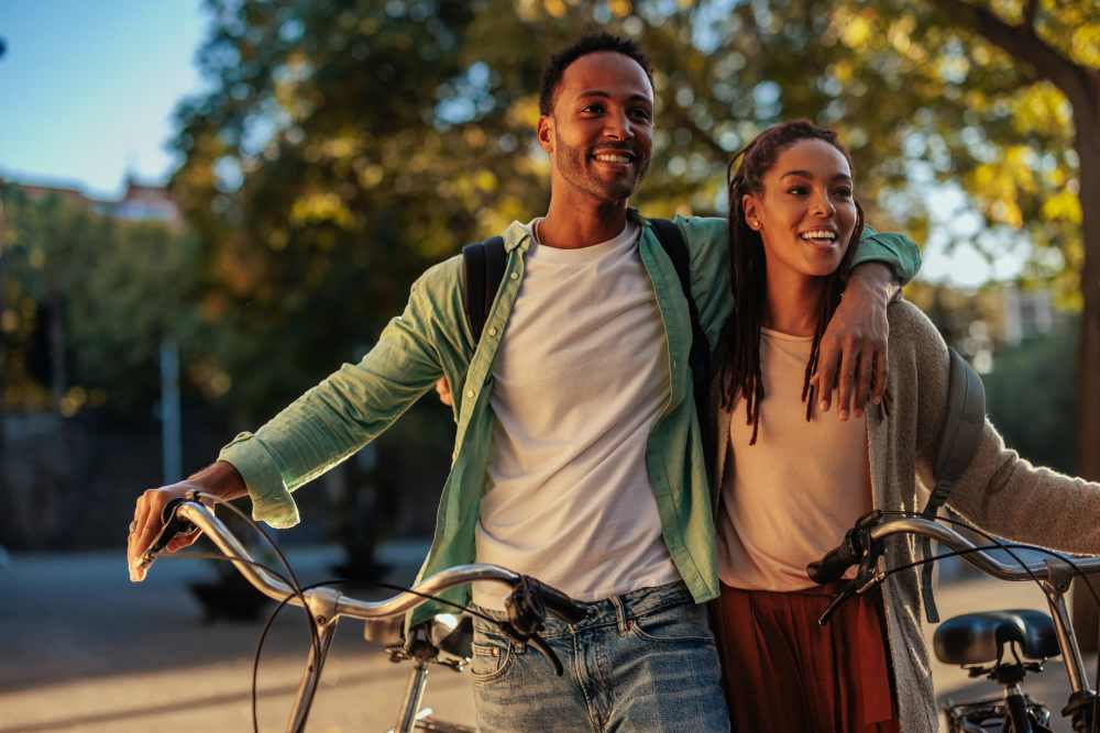 A couple walking beside their bikes near Park Haven in Fairfield, California
