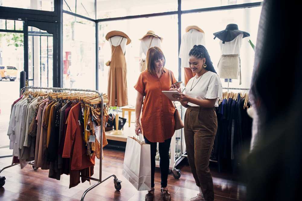 A woman shopping at a boutique near Grapeland Apartments in Grapeland, Texas