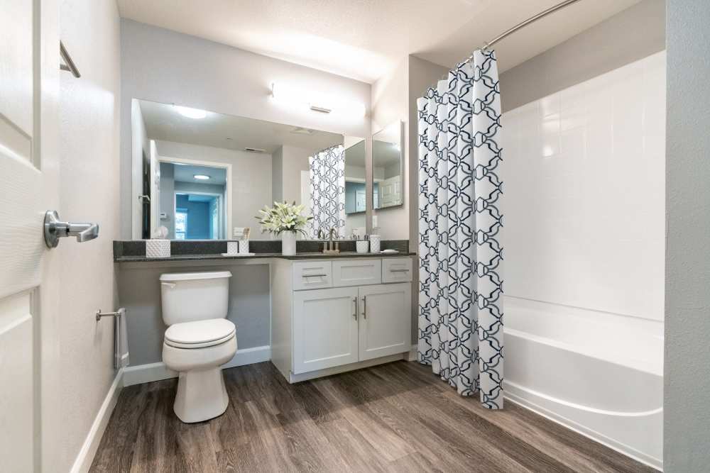 Spacious bedroom with wall art at Hawthorn Village Apartments in Napa, California