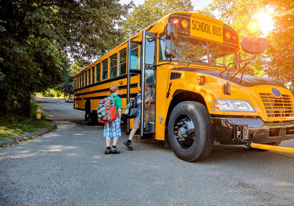 Kids boarding school bus at Cotton Wood Apartments in Dublin, California