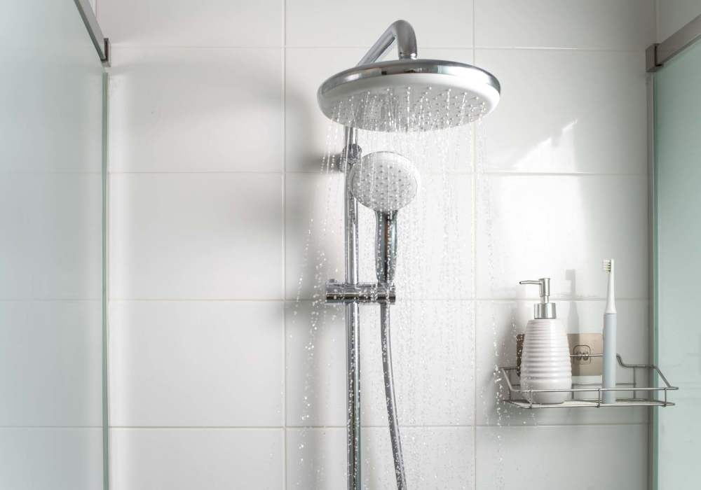 Shower in bathtub at Heritage Park Apartments & Townhomes in Webster, New York