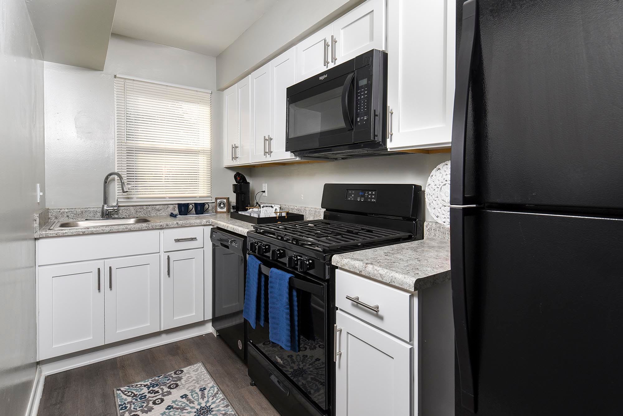 kitchen with black appliances by Chesapeake Pointe in Chesapeake, Virginia