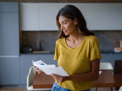 A resident reads through her mail at Marina Breeze in San Leandro, California