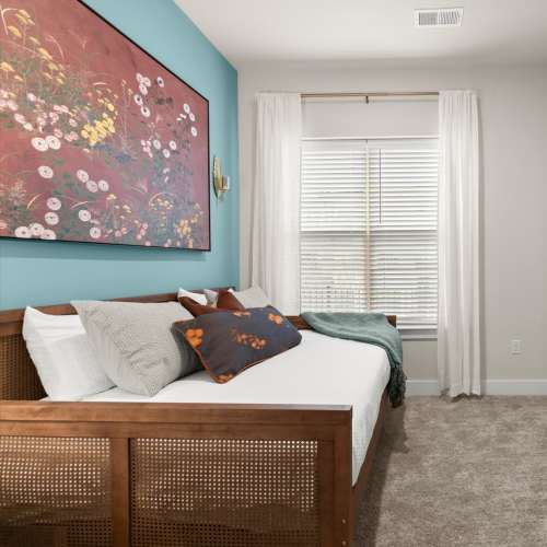 A cozy bedroom at EVOQ East Cobb in Marietta, Georgia