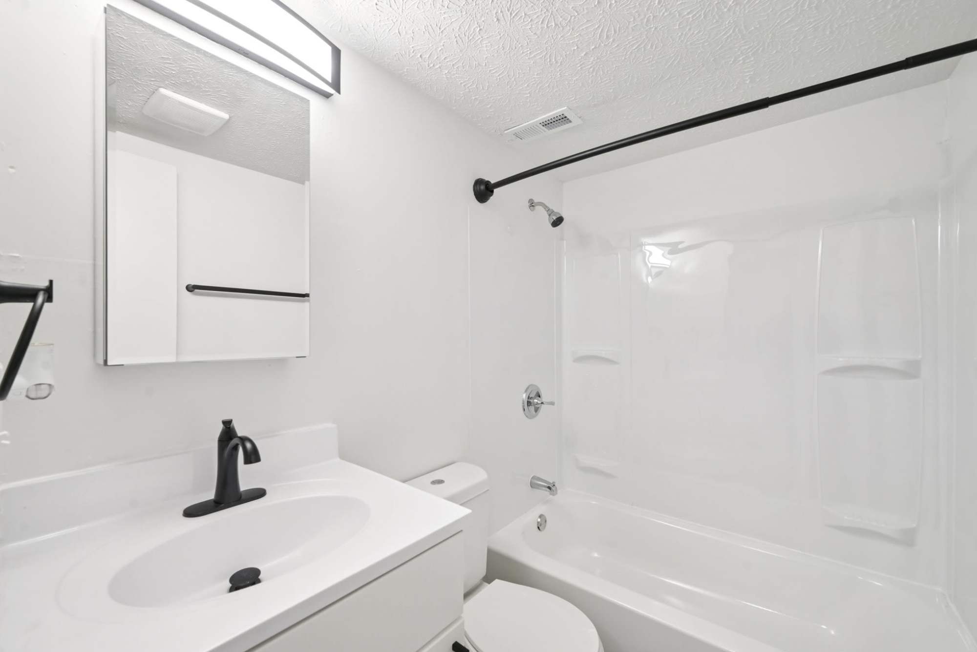 East bathroom with tub and vanity at Pointe at Northern Woods in Columbus, Ohio