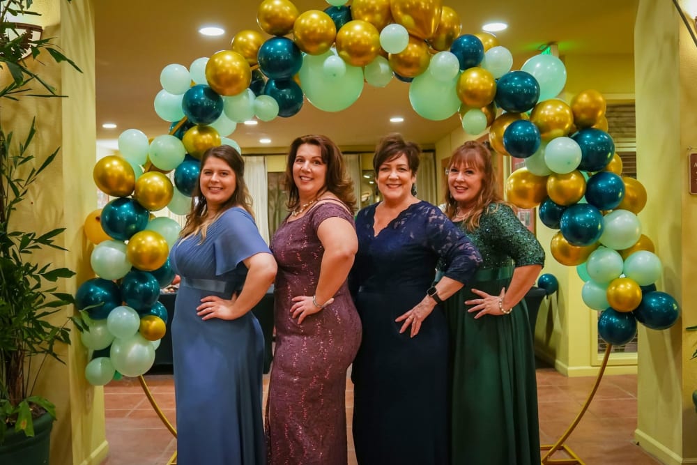 Team members posing for a photo at anniversary event at Winding Commons Senior Living in Carmichael, California