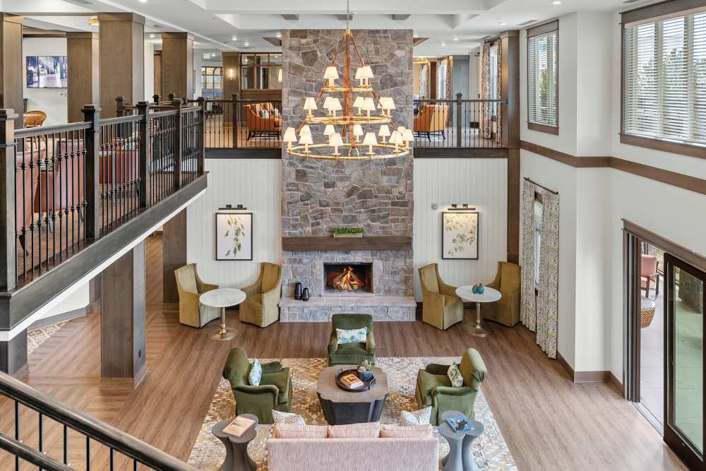 Lobby with fireplace at Amira Choice Arvada in Arvada, Colorado