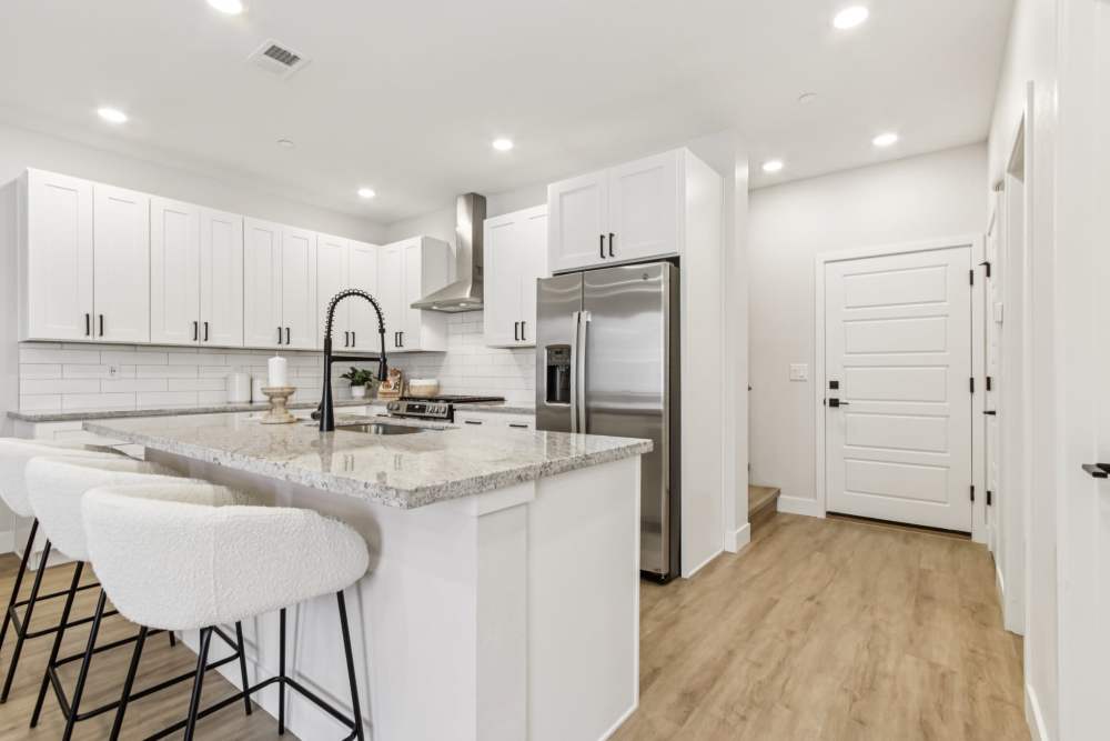 Kitchen with fridge at BB Living Colliers Hill in Erie, Colorado