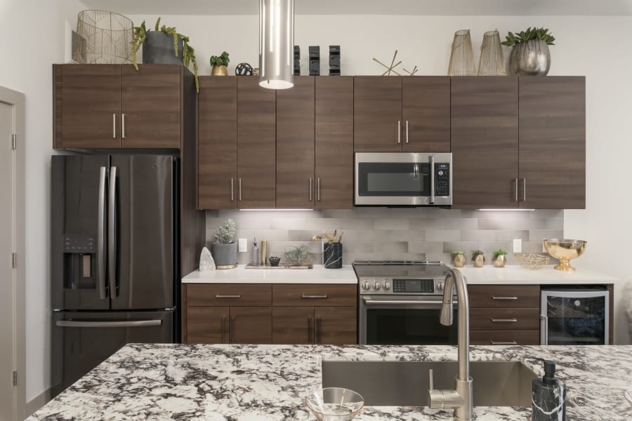 Upgraded kitchen with granite counter tops at The District at Scottsdale in Scottsdale, Arizona