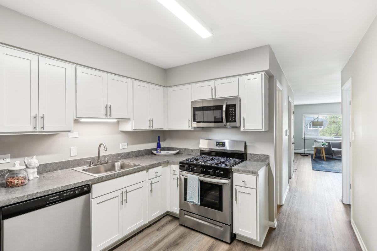 Kitchen with stainless steel appliances at Courtyards on the Park in Des Plaines, Illinois