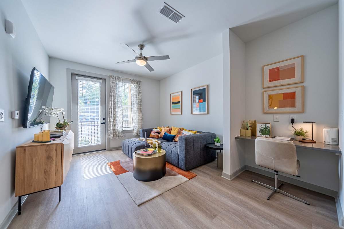 Living room area with built in desk at Corner on Main in  Jacksonville, Florida 