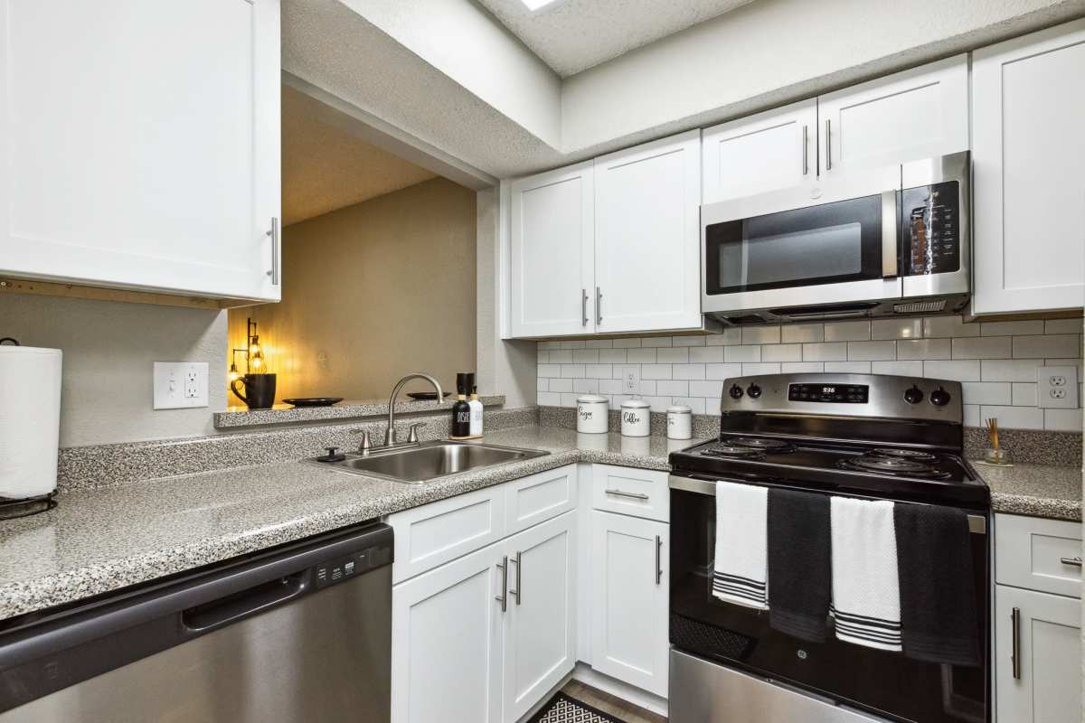 Model kitchen with stainless steel appliances at Creekside in San Angelo, Texas
