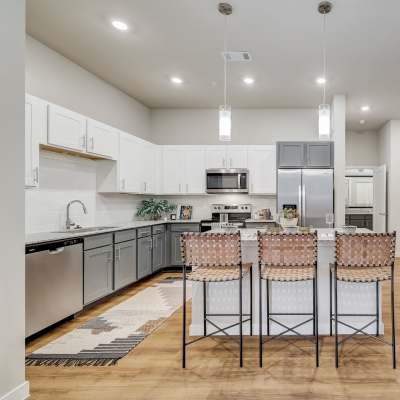Kitchen with side by side refrigerator at The Springs at Georgetown in Georgetown, Texas