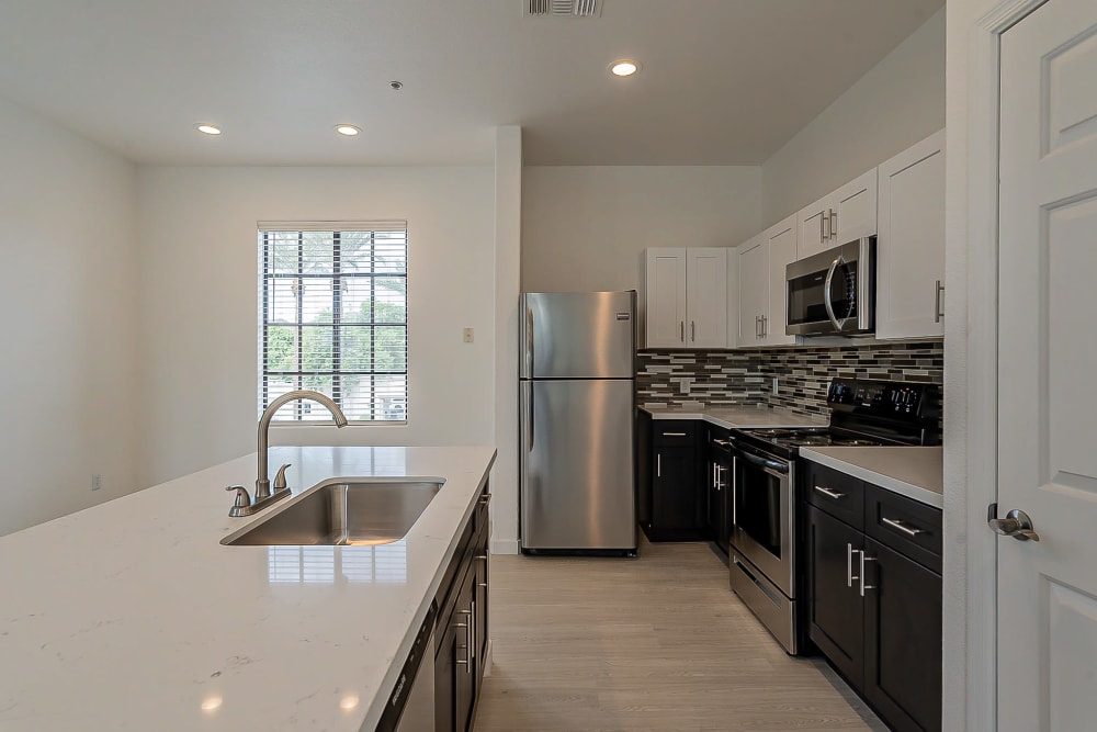 Beautiful kitchen with stainless-steel appliances at Main Street Lofts at Verrado in Buckeye, Arizona