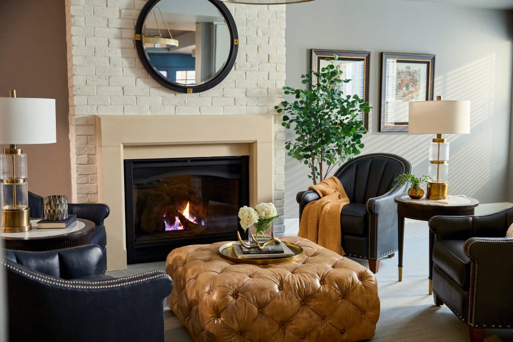 Lounge with a fireplace and lots of seating at Amira Choice Bloomington in Bloomington, Minnesota