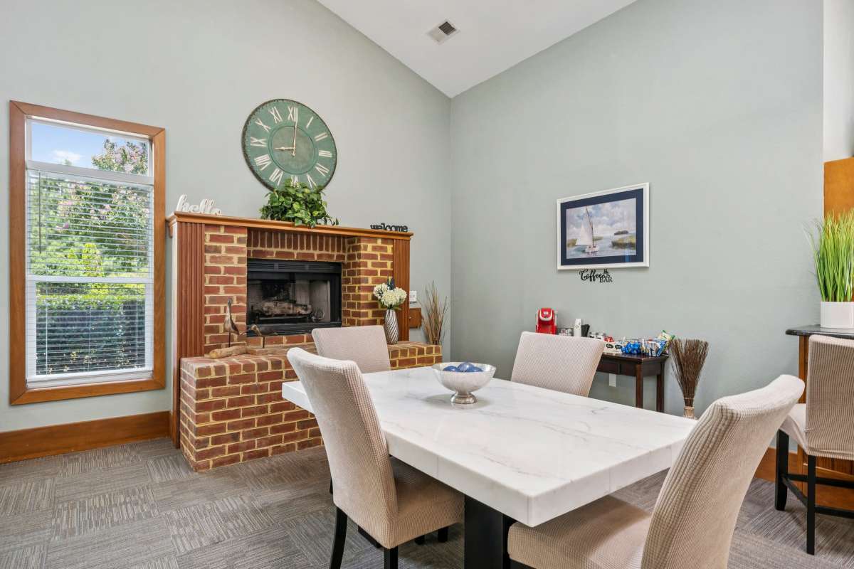 Dining area with fireplace at Bradford Mews in Smithfield, Virginia