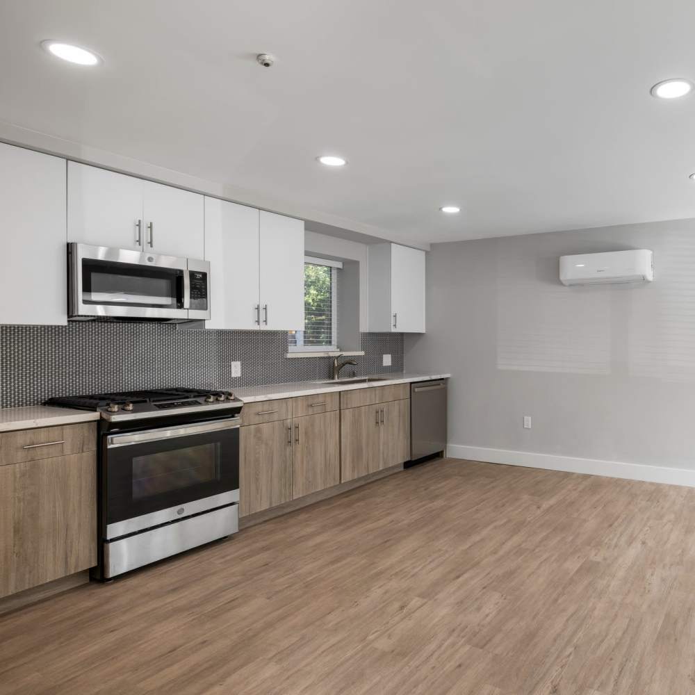 Well-designed kitchen with hardwood flooring at Crossbrook Apartments in Rohnert Park, California