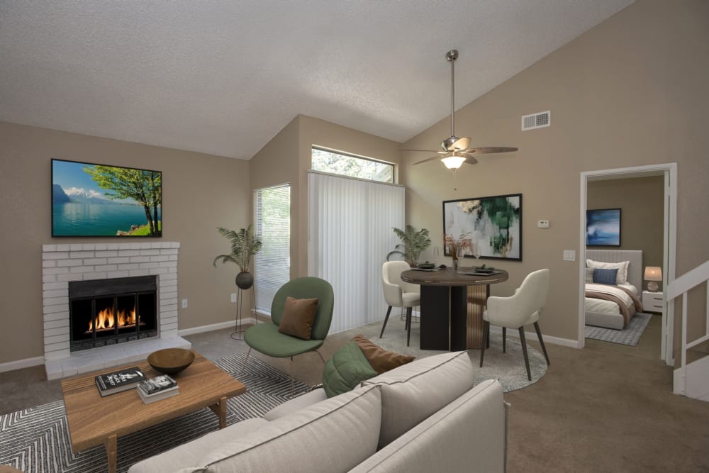 Living room area with fireplace at Huntcliffe Apartments in Fair Oaks, California