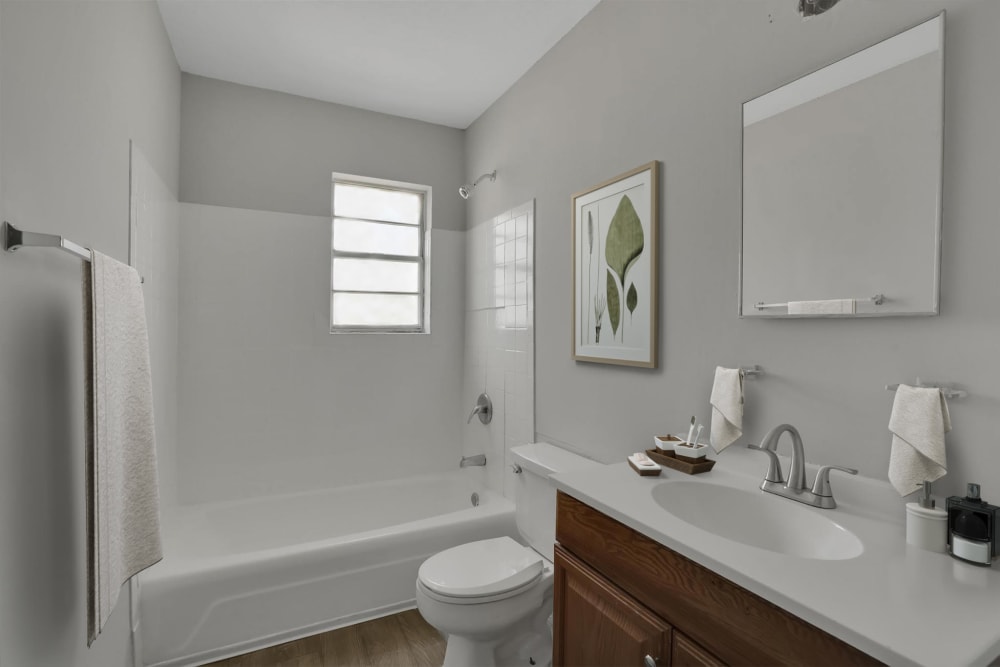 A fully bathtub in a bathroom at Garrett Woods Apartment Homes in Phenix City, Alabama