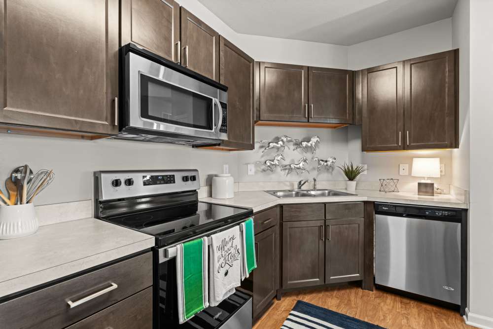 Spacious kitchen with range and oven at The Crossings At Milestone in Pensacola, Florida