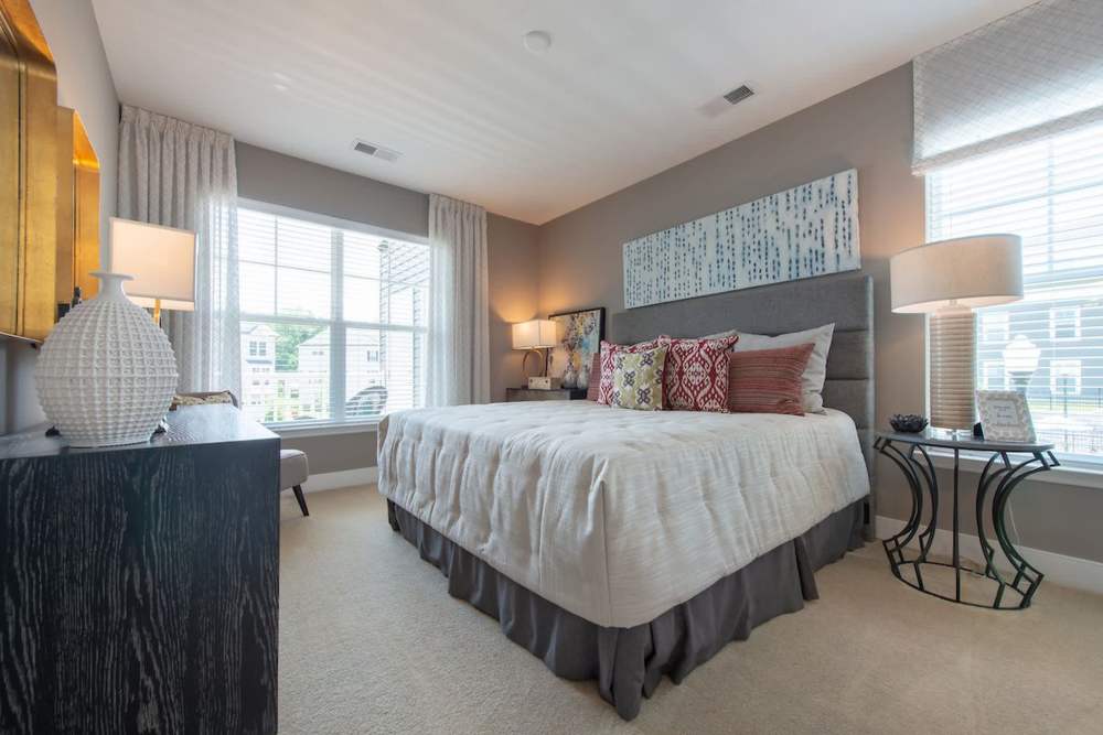 Spacious Bedroom with Bed and side lamps at The Elms at Signal Hill Station in Manassas, Virginia