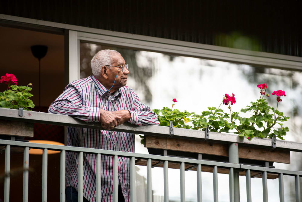 Resient relaxing on his patio Vista Prairie at Goldfinch Estates in Fairmont, Minnesota