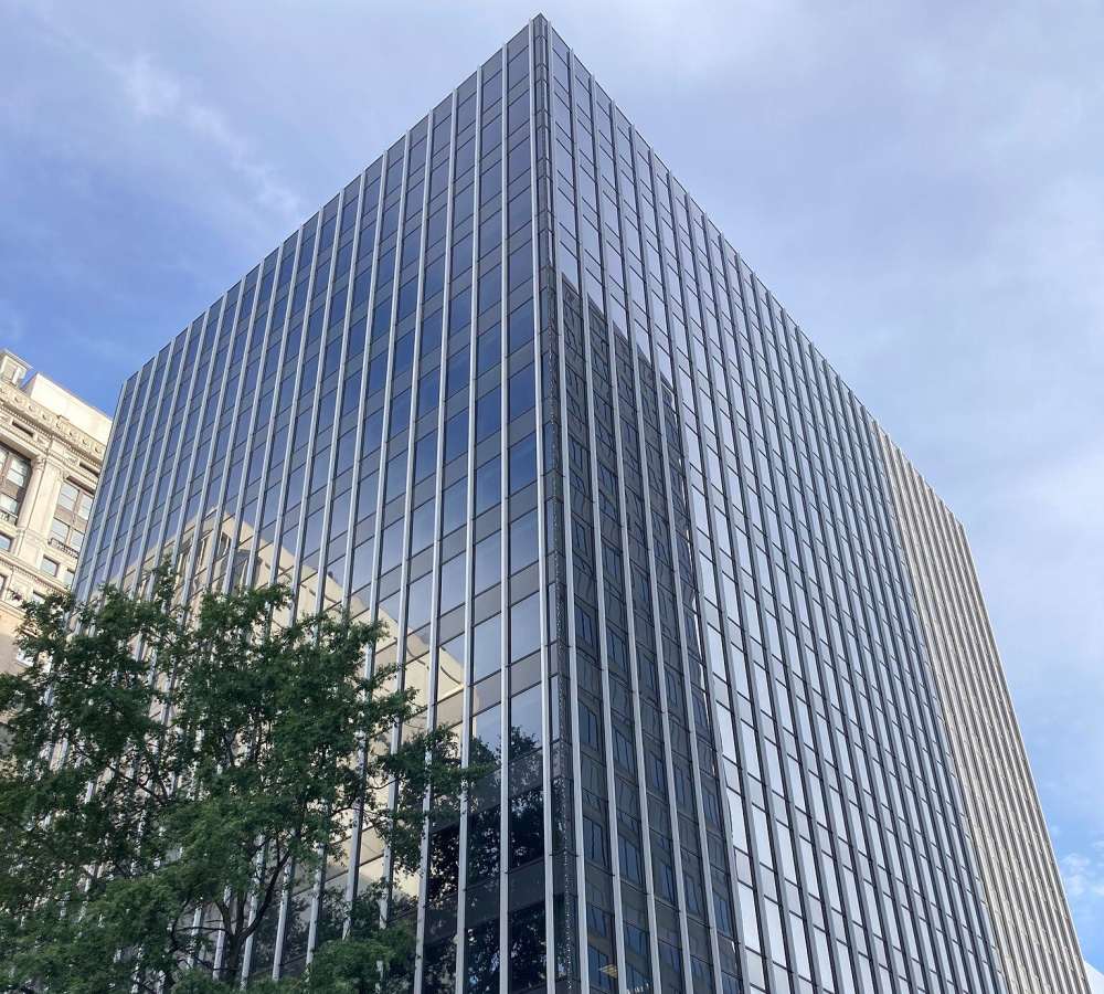 Exterior view of the community building with galss panels at Altitude on Main in Richmond, Virginia