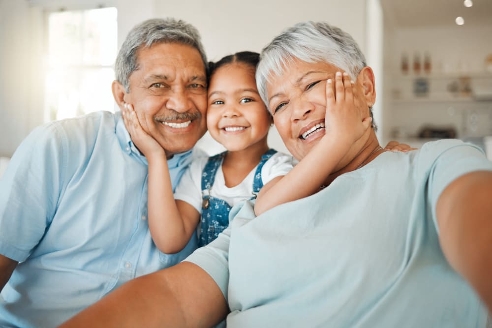 Resident couple being visited by a younger family member at Pilot Butte Rehabilitation Center in Bend, Oregon