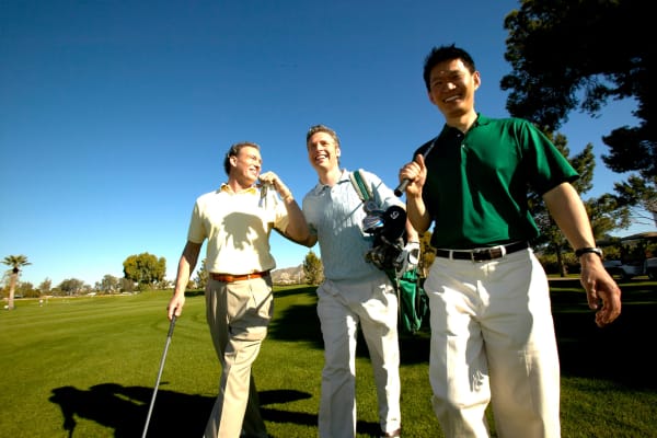 Group of friends out playing golf together on a clear day near BB Living Murphy Creek in Aurora, Colorado