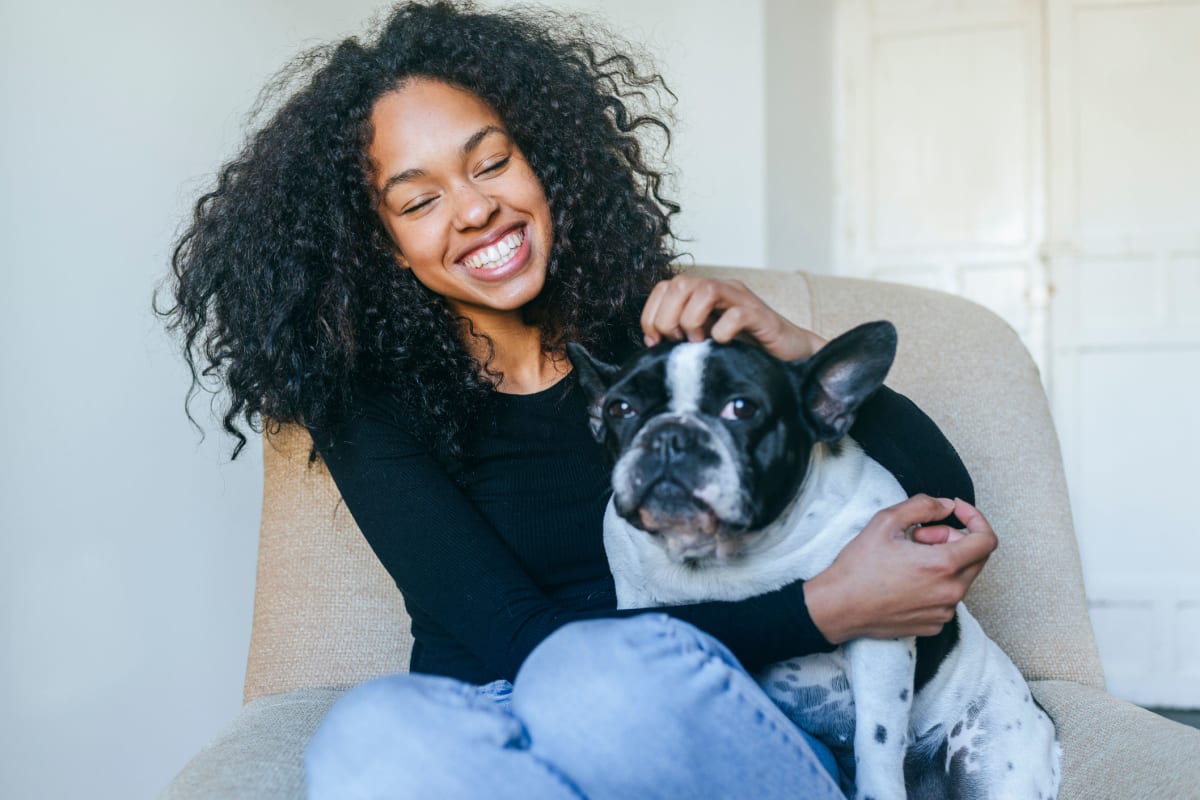 Resident petting her dog at Crescent at Shadeland in Lexington, Kentucky