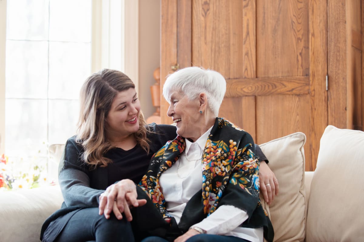 Resident sitting and talking with their daughter at Fields Senior Living in Olympia, Washington