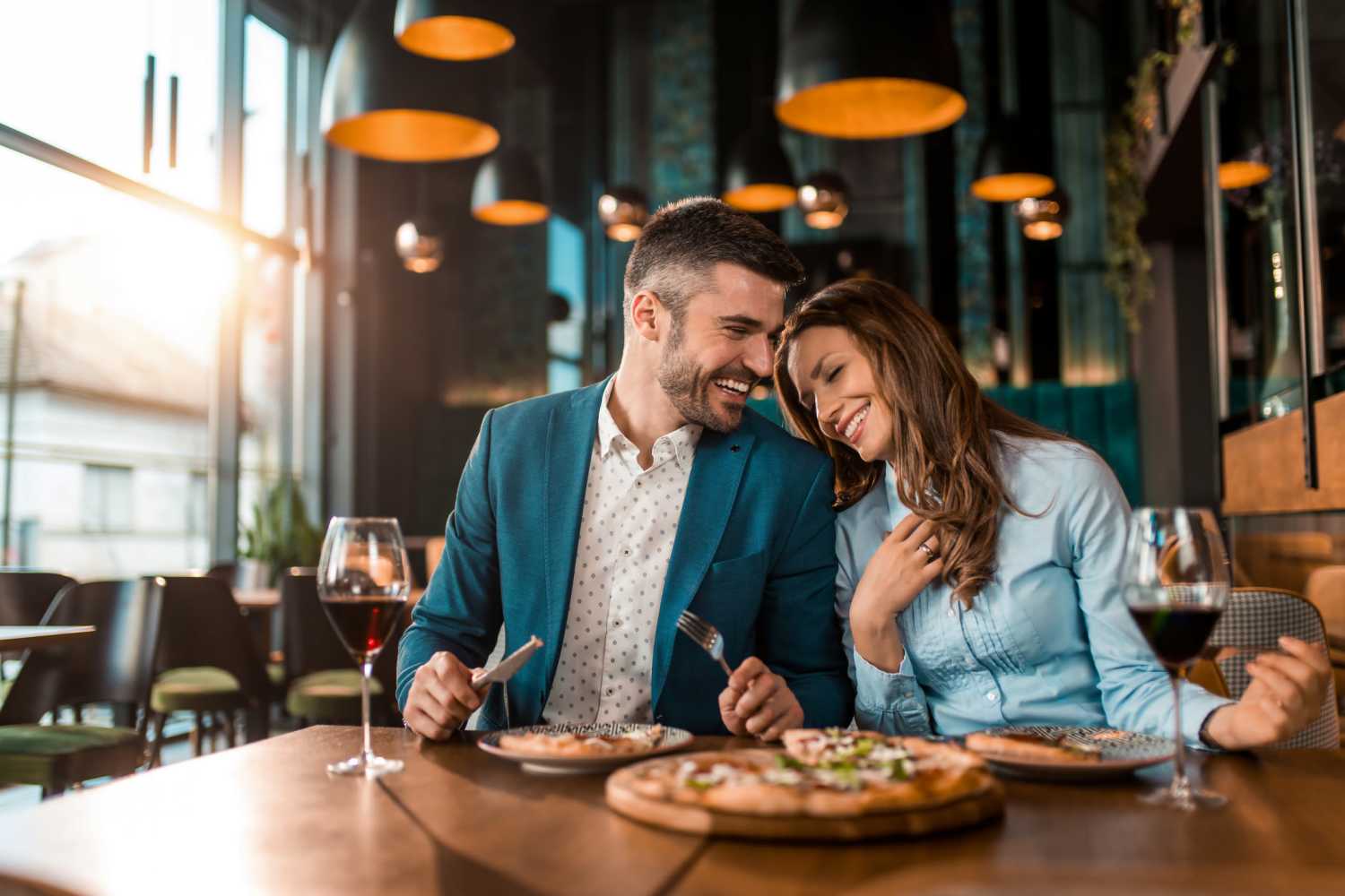 Couple eating at a restaurant near Palisades Sierra Del Oro in Corona, California