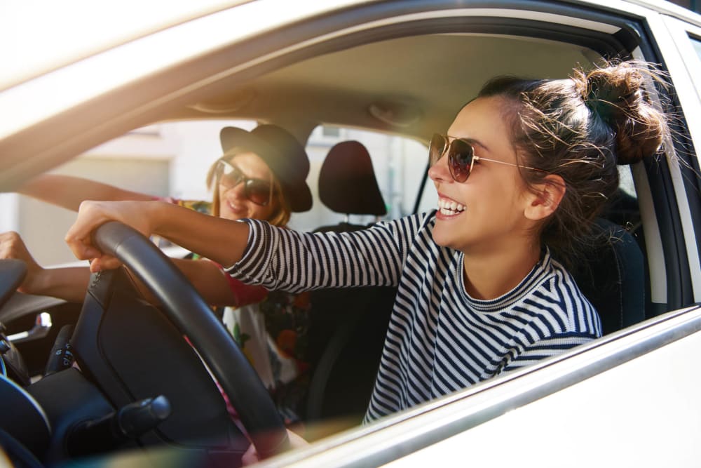 Friends riding in a car together near Villager Apartments in Irvington, New Jersey