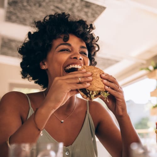 A resident eating a burger at Silver Strand II in Coronado, California