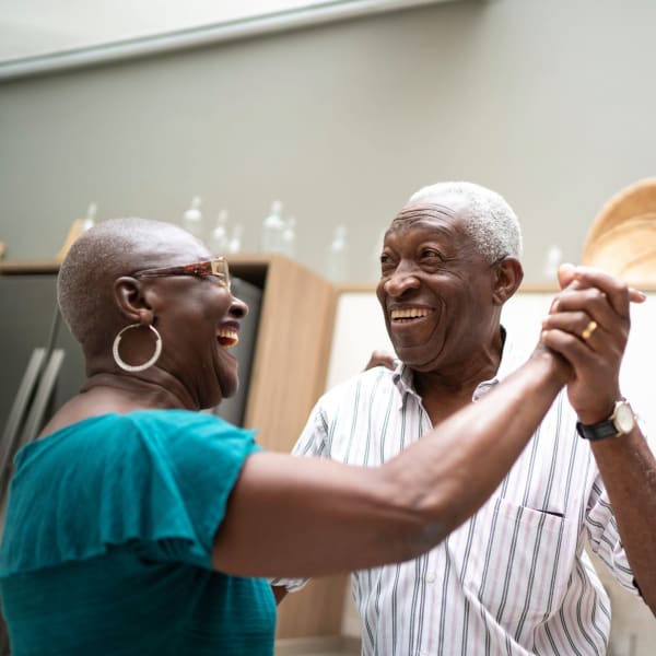 Residents dancing at Tampa Gardens Senior Living in Tampa, Florida.