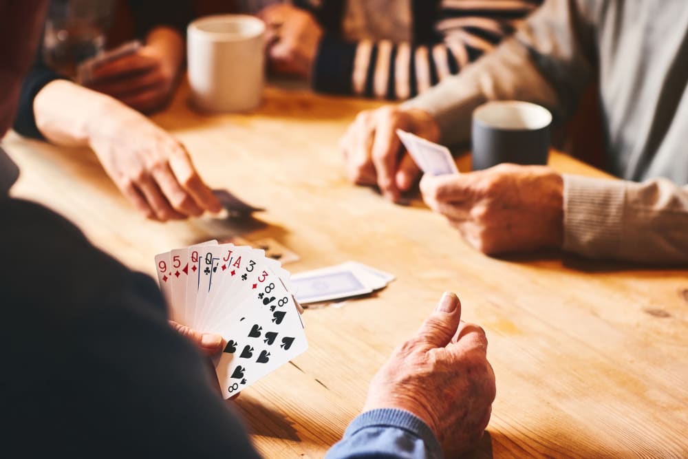 People playing cards at The Vista in Esquimalt, British Columbia.
