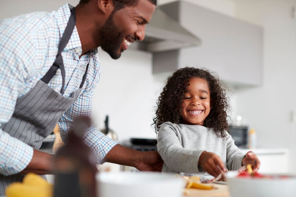 Resident and his daughter loving their new home at 210-220 E. 22nd Street in New York, New York