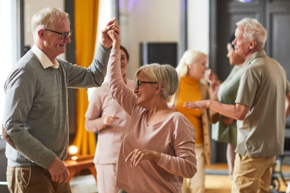 Residents dancing at a Ridgeline Management Company senior living property