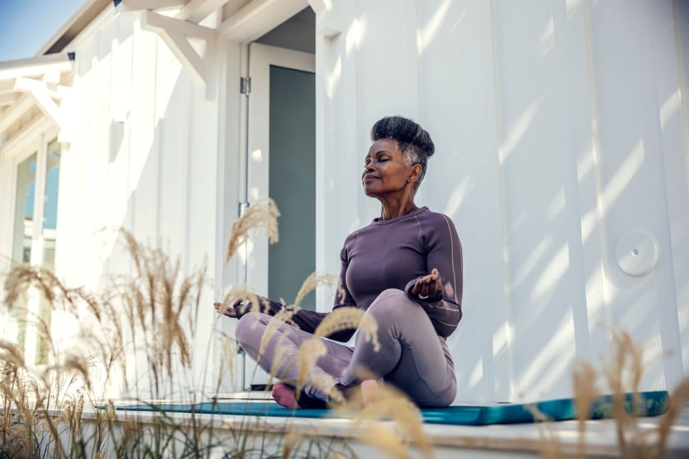 Resident doing yoga near The Retreat at Renaissance in Charlotte, North Carolina