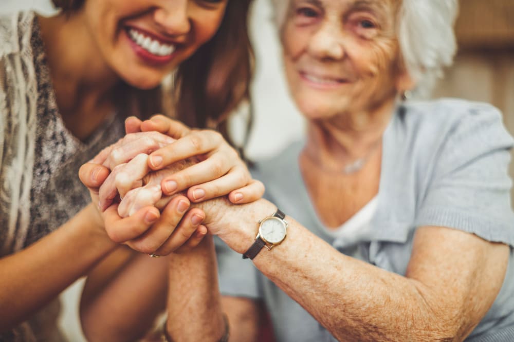 A woman embracing an elderly woman at Greenfield Estates in Akron, Ohio