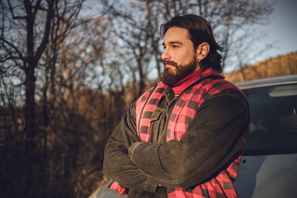 Resident contemplating the mountains at Traxx Apartments in Mountlake Terrace, Washington 