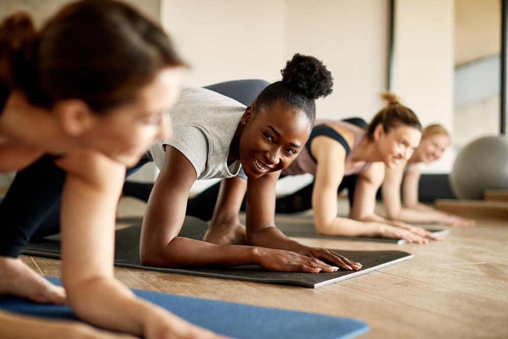 Residents in a yoga class at the onsite wellness center at Florence Apartments in Los Angeles, California