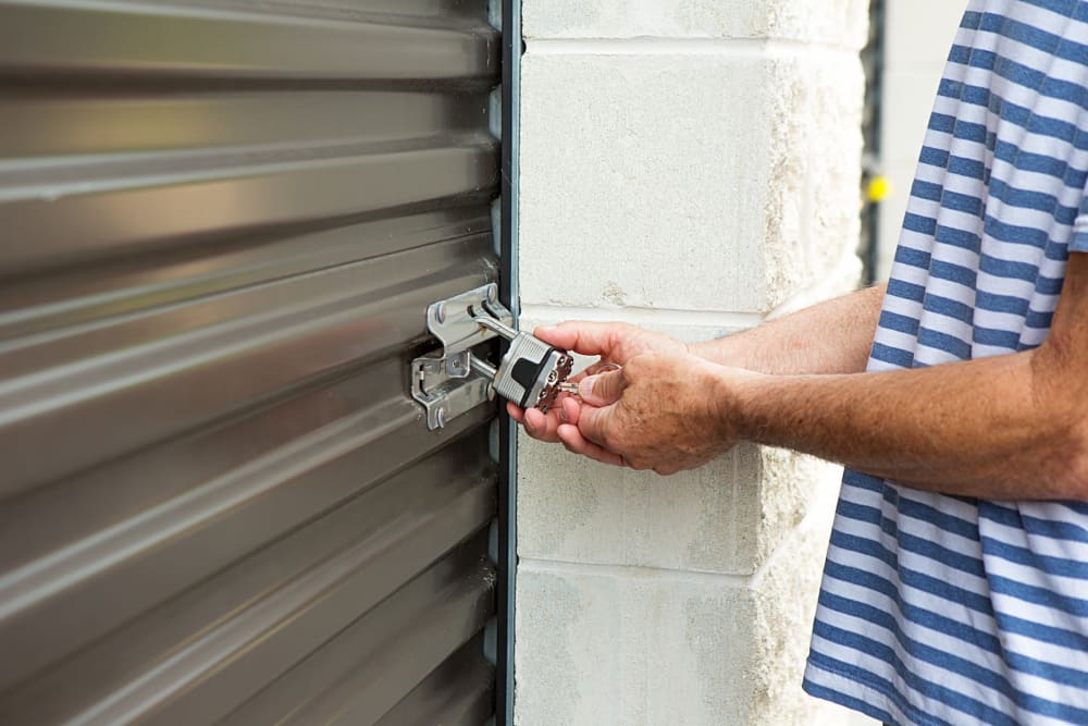 A customer unlocking his unit at Storage Star Laredo in Laredo, Texas