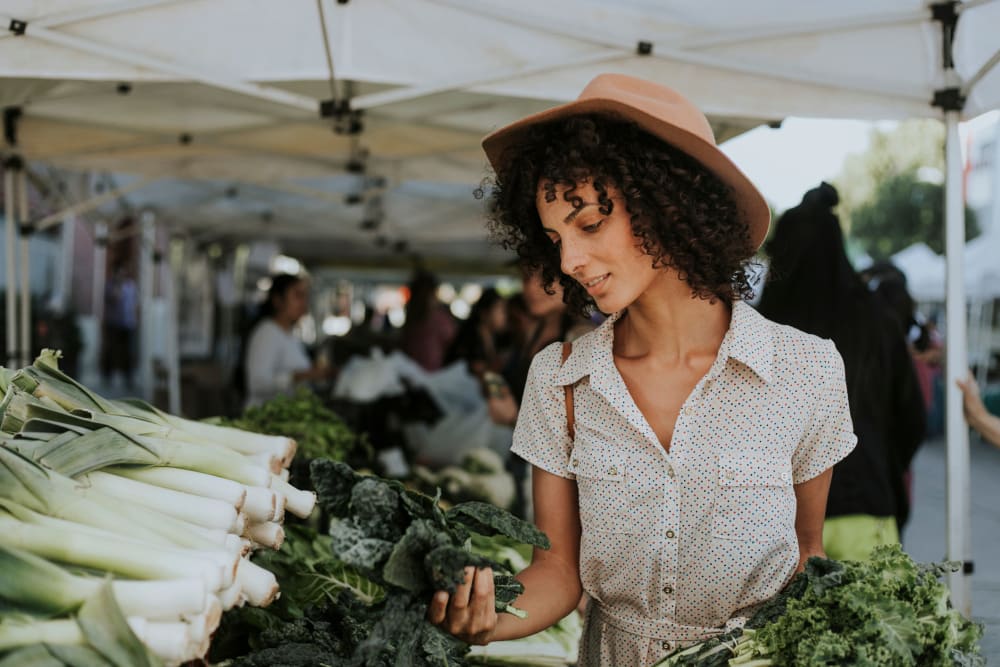 Woman shopping at the local farmers market near The Planet in Toronto, Ontario