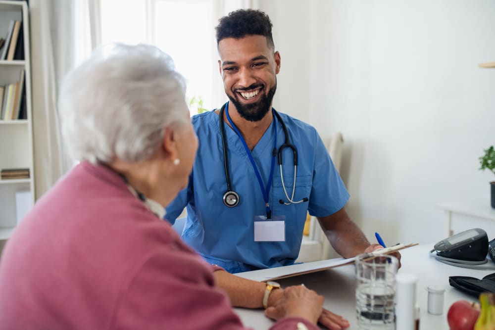 Nurse talking to patient  at Vista Prairie at Goldfinch Estates in Fairmont, Minnesota