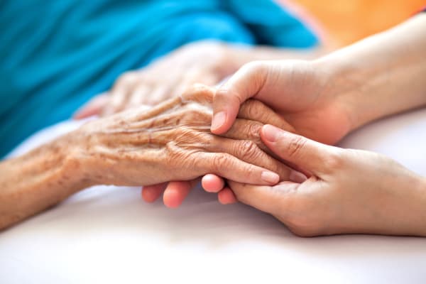 Two people holding hands at Senior Commons at Powder Mill in York, Pennsylvania