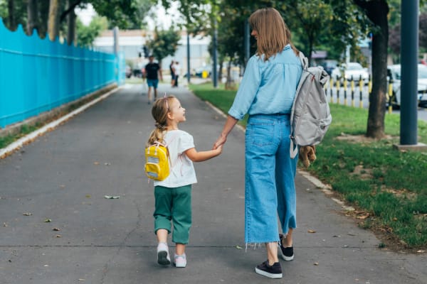 A resident walking with her child at Ravello 192 in Elkhorn, Nebraska