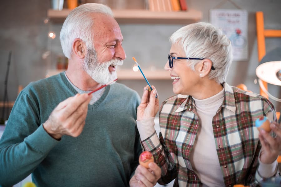 A resident couple painting at Applewood Pointe of Blaine in Blaine, Minnesota.